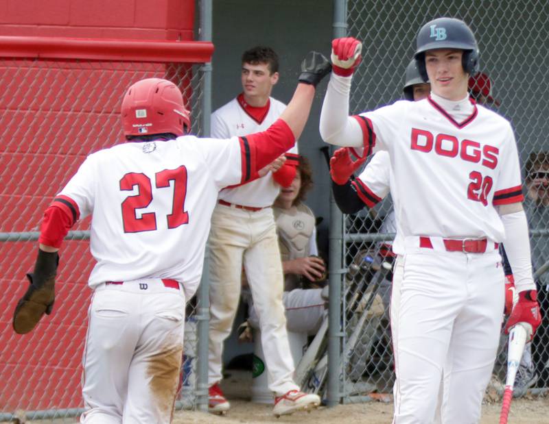 Streator's Brady Grabowski (20), shown in this 2021 file photo congratulating teammate Parker Phillis (27), has committed to continue his education and baseball career at Division I Murray State University.