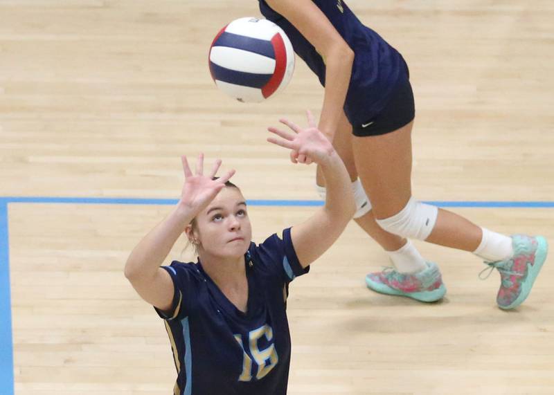 Marquette's Jakobi Reed sets the ball in the air against St. Bede on Thursday, Sept. 4, 2025 at Bader Gym.