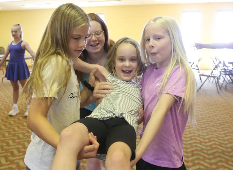 (From left) Nora Glenn, Ryen Pettett, Ruby Stash, Noelle Briggs and Sutter Dever rehearse a scene for the upcoming musical Annie Jr. on Tuesday, June 24, 2025 at the First United Methodist Church in Henry. The show will be presented July 25-27 at the River Valley Players theater in Henry, .