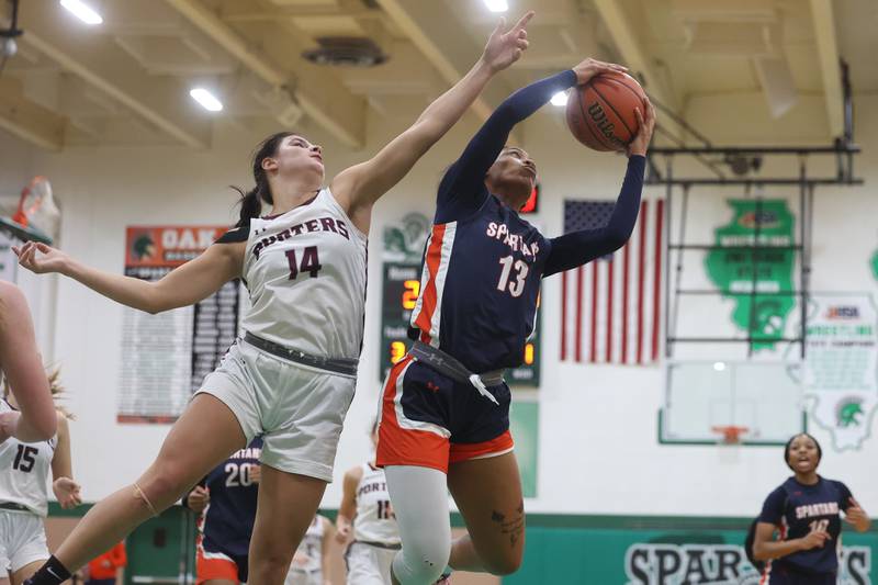 Romeoville’s Jadea Johnson beats Lockport’s Veronica Bafia for the rebound in the Oak Lawn Holiday Tournament championship on Saturday, Dec.16th in Oak Lawn.