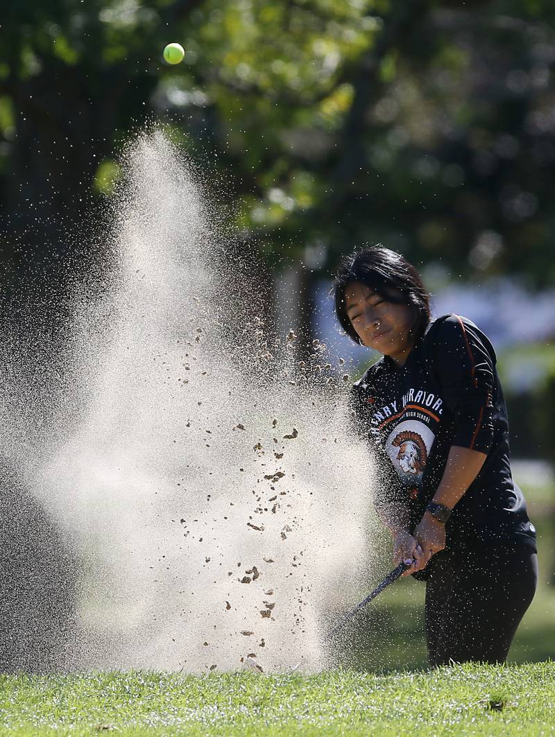 McHenry’s Jennifer Henry hits out of sand trap on the first hole during the IHSA Class 2A Huntley Girls Golf Regional on Tuesday, Oct. 1, 2024, at Pinecrest Golf Club in Huntley.