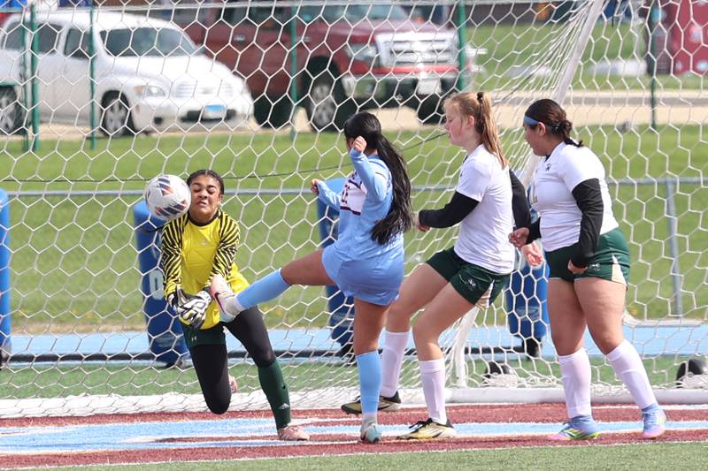 Bishop McNamara goalkeeper Kaneyce Davis deflects a shot by Kankakee's Yailen Torres during the Kays' 8-0 victory in the final All-City match on Saturday, April 11, 2026.
