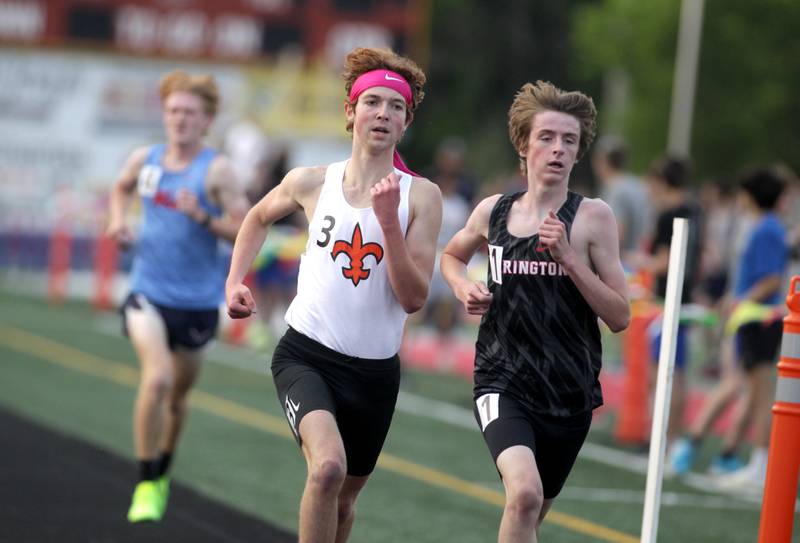 St. Charles East’s Mitch Garcia (center) and Barrington’s Joe Bregenzer (right) head into the last lap of the 3,200-meter run during the Class 3A Batavia track and field sectional on Thursday, May 18, 2023.