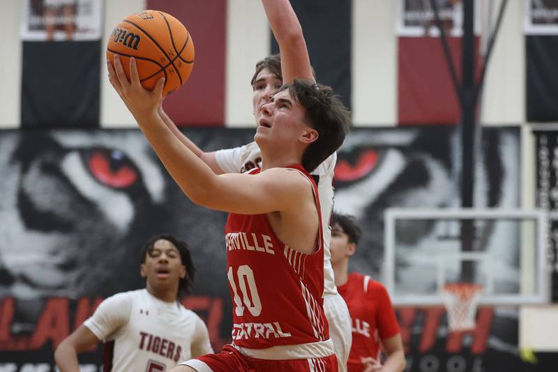 Naperville Central’s Cooper Page lays in a shot against Plainfield North on Wednesday, Jan 22, 2025 in Plainfield.