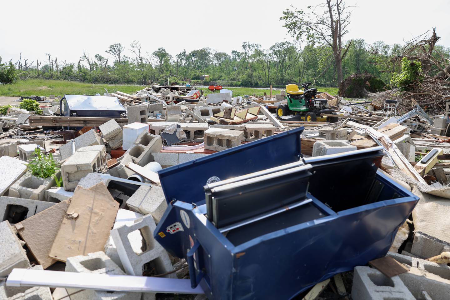 Personal belongings lay scattered among the rubble at the site of Sue Antonelli's former Sandbar Road home on May 19, 2026, following the March 10 tornado that leveled her Aroma Township property.