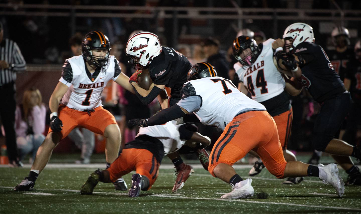 Bradley-Bourbonnais' Issac Allison, center, carries the ball on a play as a trio of Dekalb defenders make the tackle in a game on Friday, October 10, 2025.