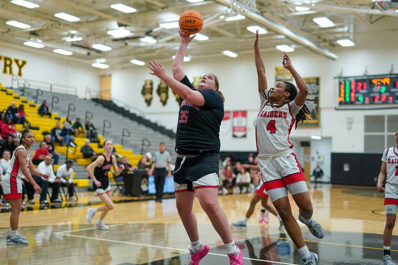 Yorkville's Madison Spychalski (35) shoots the ball in the post against Bolingbrook's Sydney Dodd (4) during a Class 4A Metea Valley Regional final basketball game at Metea Valley High School in Aurora on Friday, Feb. 21, 2025.