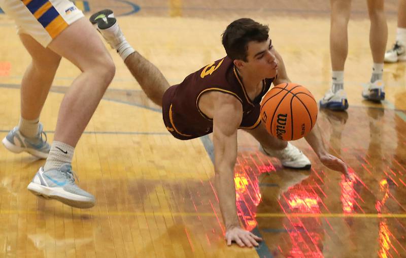 Richmond-Burton's Dane Gardner crashes to the floor after being fouled during the IHSA Class 2A Johnsburg Regional Championship boys basketball game against Johnsburg on Friday, February, 27, 2026, at Johnsburg High School.