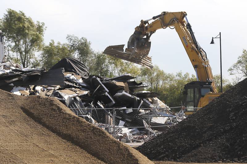 A building is removed as work continues on the site of the Water’s Edge development on Wednesday, Oct. 18, 2023, before the groundbreaking event for the development that will include new commercial buildings, townhomes and apartments.