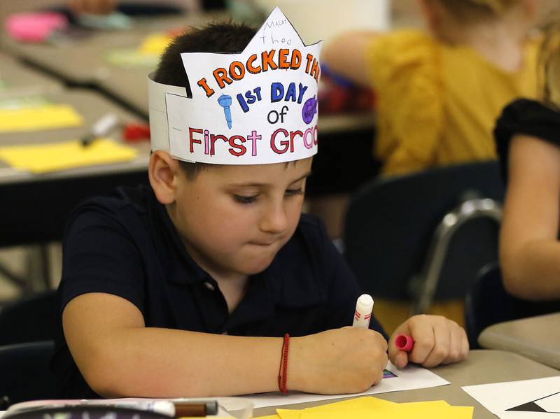 Theo Malai colors during the first day of school on Tuesday, Aug. 12, 2025, at District 300's Westfield Community School in Algonquin.