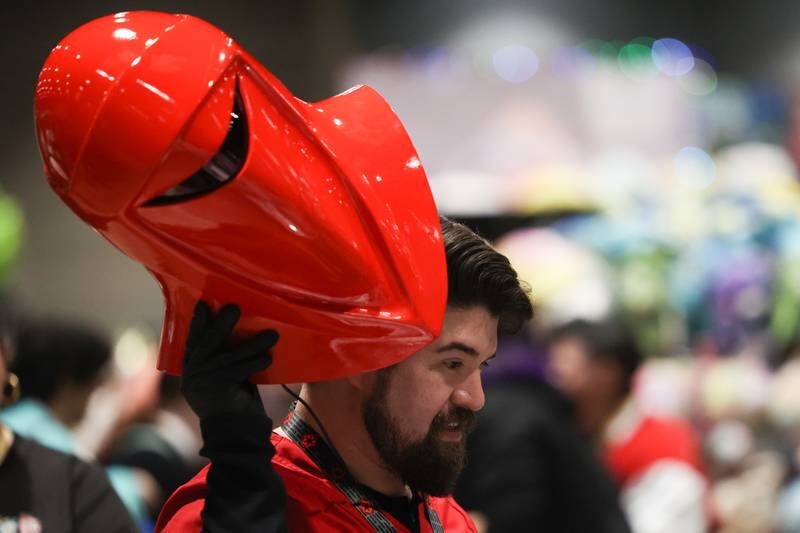 Carlos D’Aparicio, of Chicago, takes a break from his Star Wars Empirial Royal Guard costume at C2E2 Chicago Comic & Entertainment Expo on Friday, March 31, 2023 at McCormick Place in Chicago.