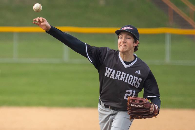 Reece Pelnarsh (21) of Streator/Woodland pitches on Thursday, April 10, 2025 at St. Bede High School in Peru.
