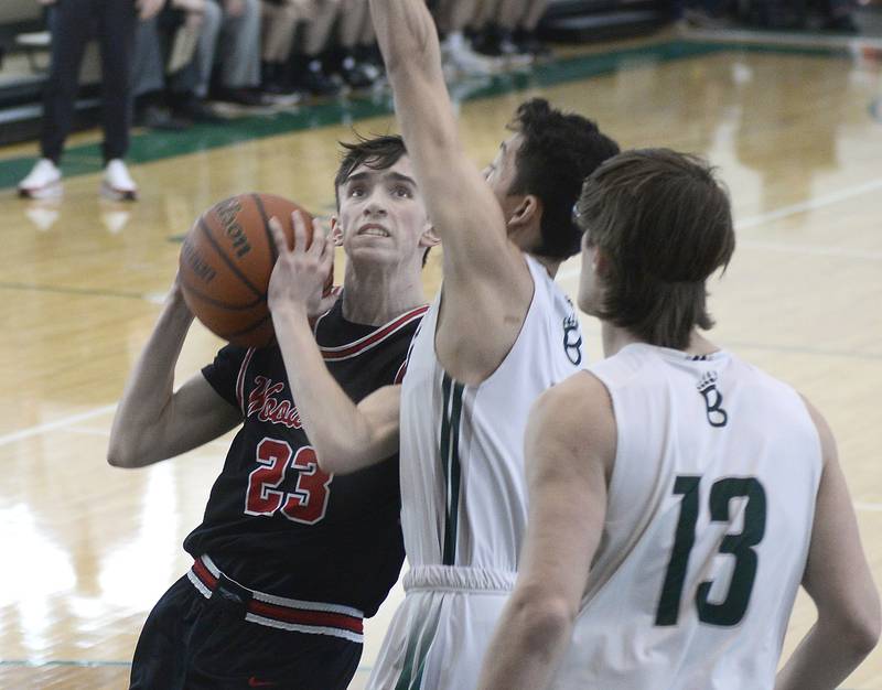 Woodland’s Nick Plesio eyes the basket as St Bede’s Isaiah Hart tries to block his shot during the 1st period of the Class 1A Regional game on Saturday, Feb. 18, 2023 at St Bede.
