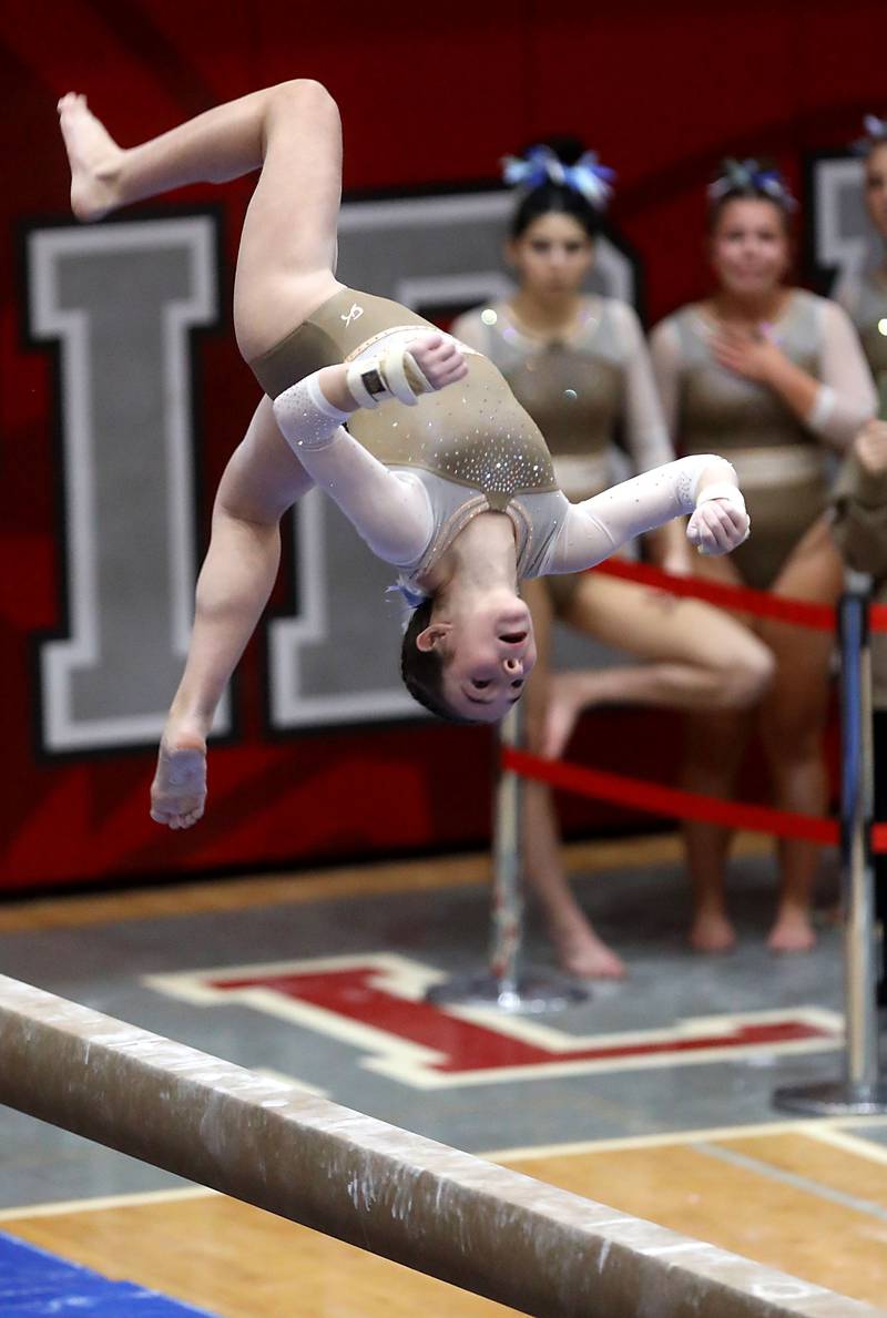 Carmel’s Brooklyn Doyle competes in the preliminary round of the balance beam on Friday, Feb. 20, 2026, during the IHSA Girls State Final Gymnastics Meet at Palatine High School.