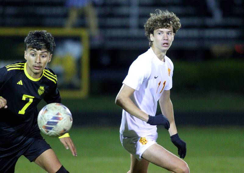 Harvard’s Jesus Aquino, left, races Richmond-Burton’s Jack Meyer for the ball in varsity soccer on Monday, Oct. 7, 2024, at Dan Horne Field on the campus of Harvard High School in Harvard.