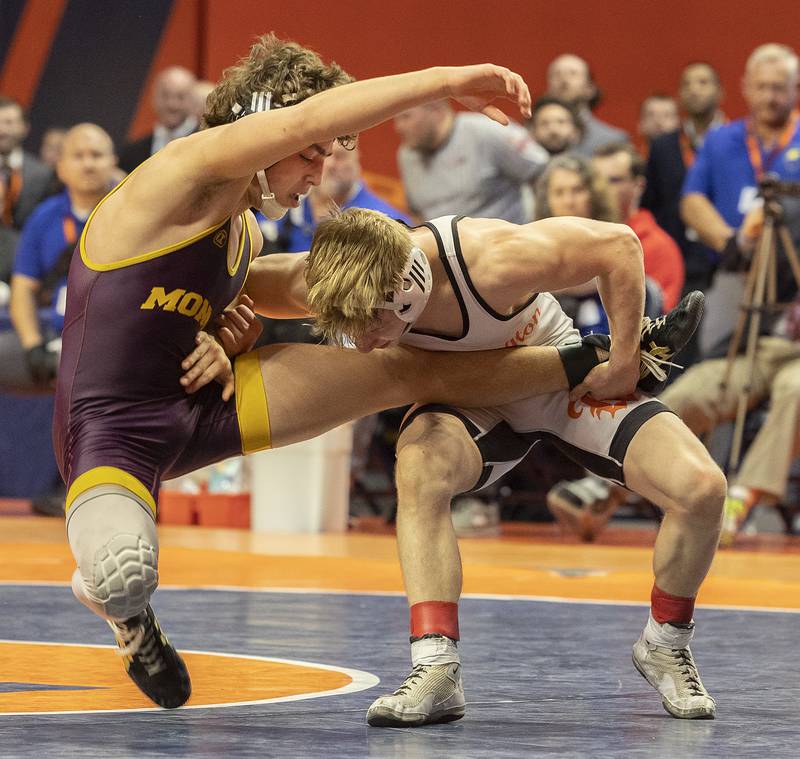 Montini’s Mikey Malizzio (left) and Washington’s Noah Woods compete in the 120 pound weight class of the 2A state individual wrestling finals Saturday, Feb. 22, 2025, at State Farm Center in Champaign.