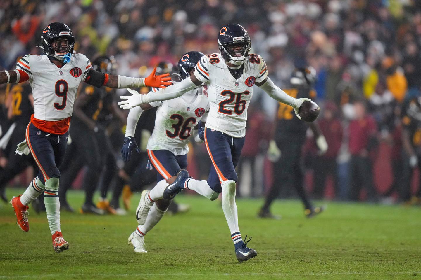 Chicago Bears cornerback Nahshon Wright (26) celebrates recovering a fumble during the second half of an NFL football game against the Washington Commanders, Monday, Oct. 13, 2025, in Landover, Md. (AP Photo/Stephanie Scarbrough)