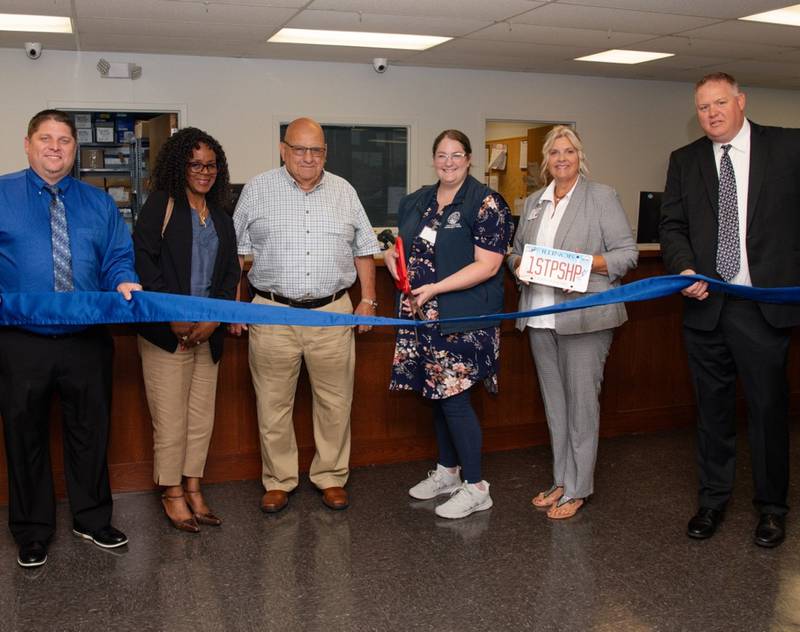 (From left) Secretary of State’s DMV IT Operations Manager Andy Simmons; County Administrator Sharon Schallhorn; Vice County Board Chair Keith Cain, Princeton DMV Facility Manager Whitney Mccafferty and Driver Services Director Kevin Duesterhaus cut the ribbon Wednesday, July 31, 2024, on the newly upgraded Princeton One-Stop-Shop DMV.