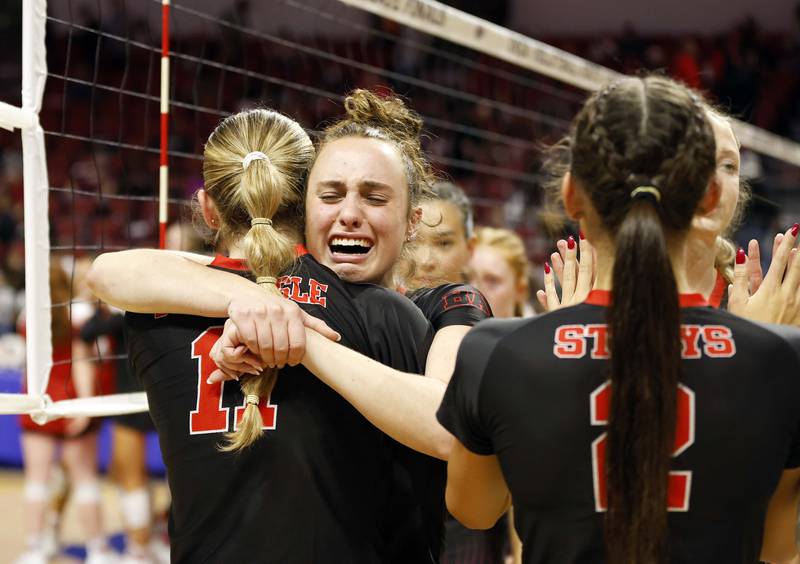 Benet Academy's Ellie Stiernagle (11) and Sophia Pursley (18) react after their loss in the IHSA Class 4A girls volleyball championship match Saturday, Nov. 16, 2024 at CEFCU Arena in Normal.
