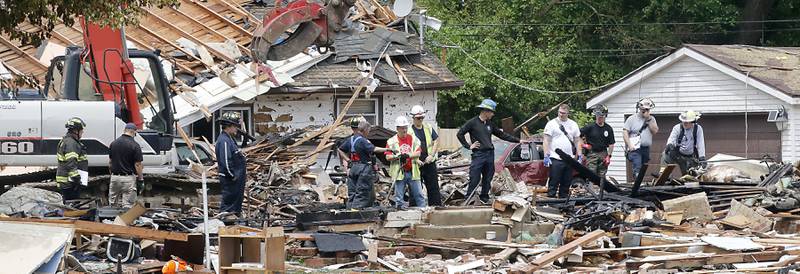 Authorities look for the cause of a home explosion on Monday, May 18, 2026, in 7400 block of Birch Drive, in Wonder Lake, after the Sunday evening explosion. One resident of a home was killed and two others have been taken to the hospital.