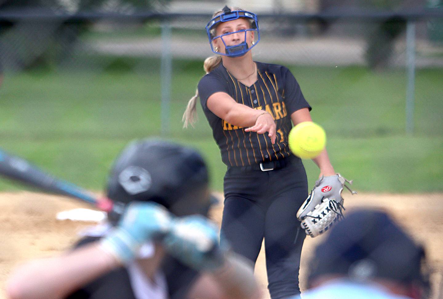 Harvard’s Tallulah Eichholz fires toward home plate against Prairie Ridge during Class 3A softball regional final action at Lions Park in Harvard Friday.