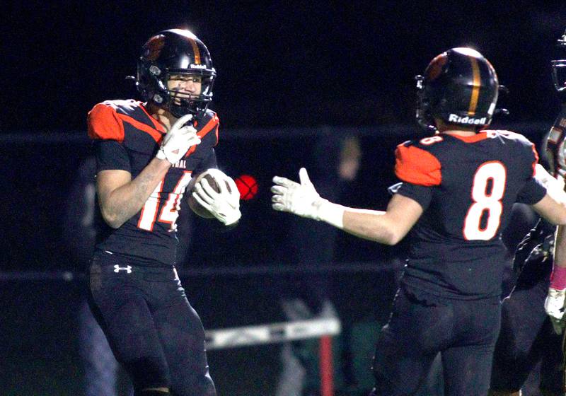 Crystal Lake Central’s George Dimopoulos, left, is greeted in the end zone after a touchdown reception against Jacobs in varsity football at Metcalf Field on the campus of Crystal Lake Central Friday night.