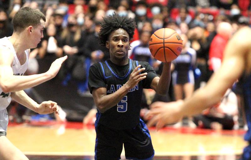 Larkin’s Jamarion Stubb passes the ball during a 4A DeKalb Supersectional game against Glenbard West at the Northern Illinois University Convocation Center on Monday, March 7, 2022.