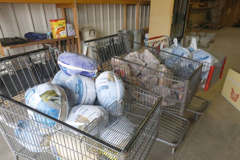 Cartfuls of turkeys and hams wait to be given out during the Easter distribution on Wednesday, March 25, 2026 at the Illinois Valley Food Pantry in Peru.