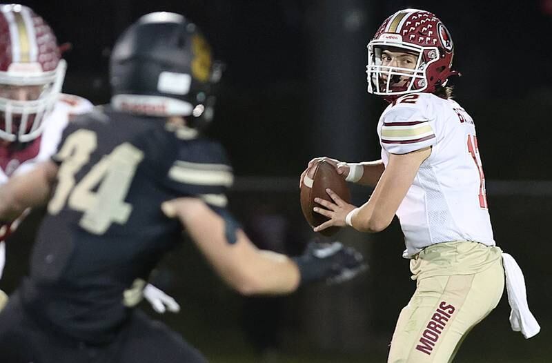 Morris' Carter Button looks for a receiver during their game against Sycamore Friday, Oct. 21, 2022, at Sycamore High School.