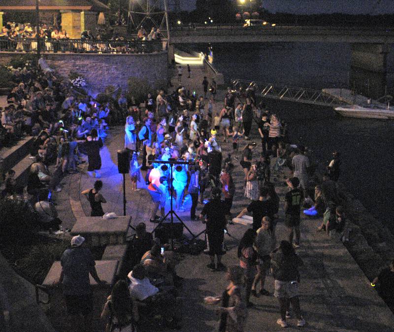 The crowd dances along the riverfront before the drone light show during Venetian Night in Dixon on Aug. 9, 2025.