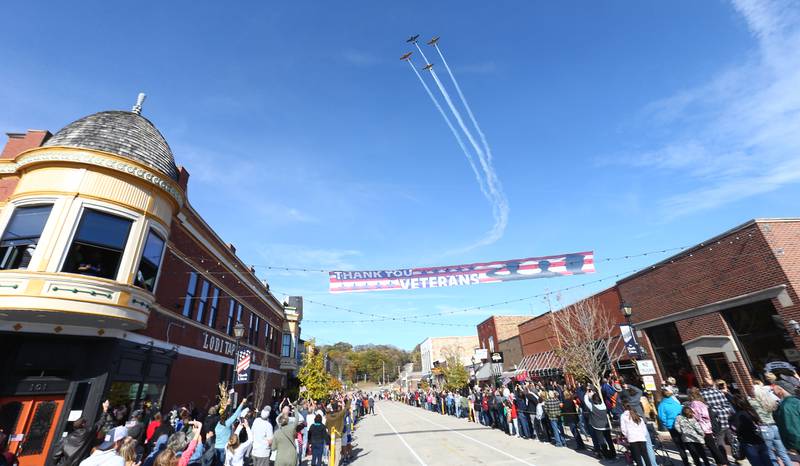 Lima-Lima planes fly over Mill Street downtown Utica on Sunday Nov. 7, 2021 for the 14th annual Utica Veterans Parade and Air Show.