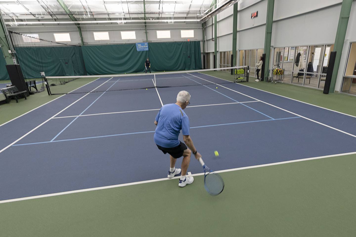 Bob Orta practices tennis with Westwood Tennis Pro Chris Dudley on Thursday, March 19, 2026.