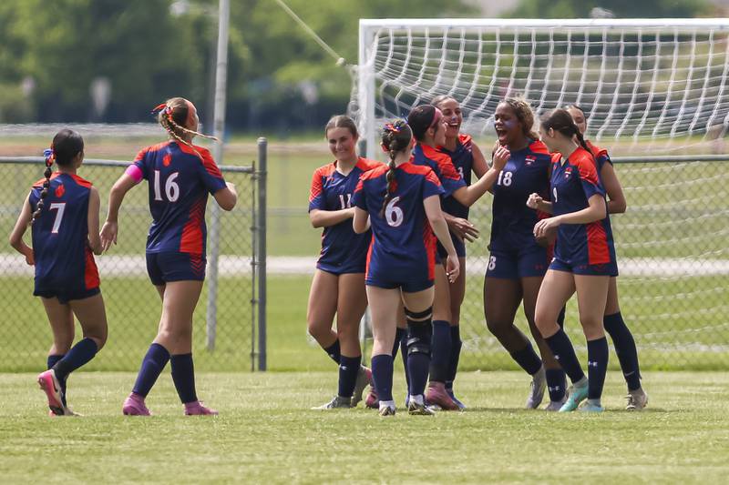 Oswego's Jordyn Washington (18) celebrates her second goal with teammates during Class 3A regional final soccer match between Neuqua Valley at Oswego on Saturday, May 23, 2026 in Oswego.