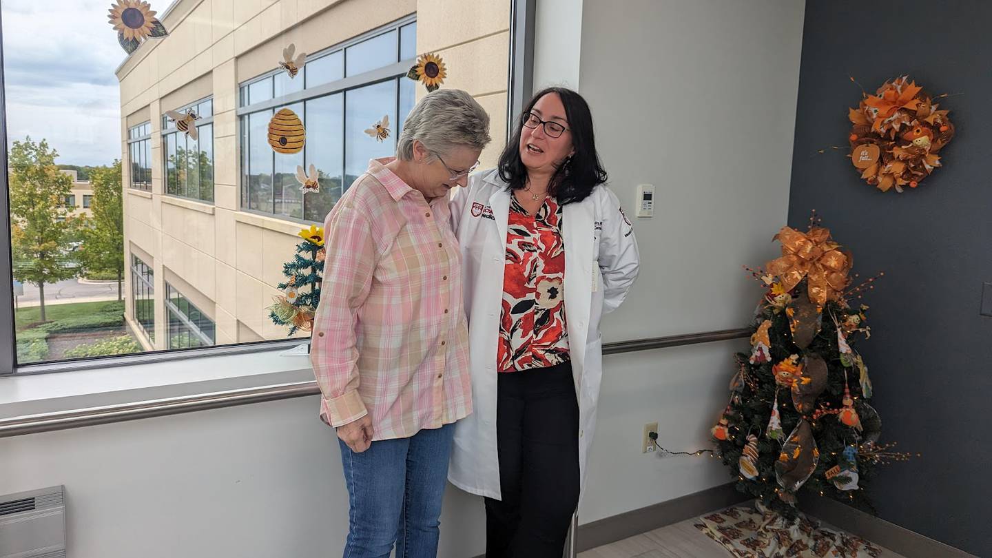 Annamae Ginter, 70, of Oak Forest (left) popped into Silver Cross Hospital in New Lenox on Friday, October 6, 2023, to thank her providers for such terrific care. Ginter is seen with Dr. Simona Cosmina Chivu, a board certified oncologist at the UChicago Medicine Breast Clinic at Silver Cross Hospital, who treated Ginter.