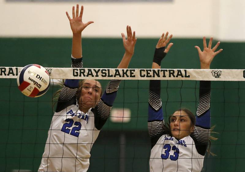 St. Francis' Addy Horner and Emma Delaney block a Prairie Ridge hit during the IHSA Class 3A Grayslake Central Supersectional volleyball match on Monday, Nov. 11, 2024, at Grayslake Central High School.