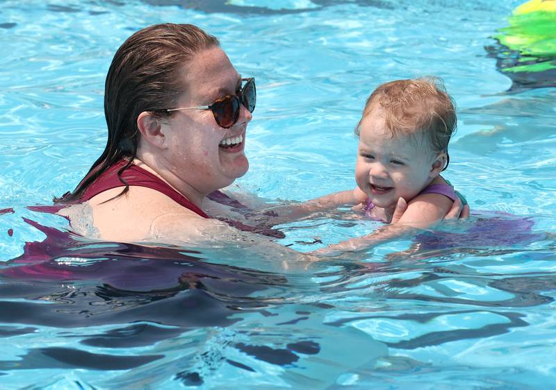 Beverly Gardner and her daughter Daphne, 2, from DeKalb, beat the heat with a swim Tuesday, July 25, 2023, at Hopkins Pool in DeKalb.