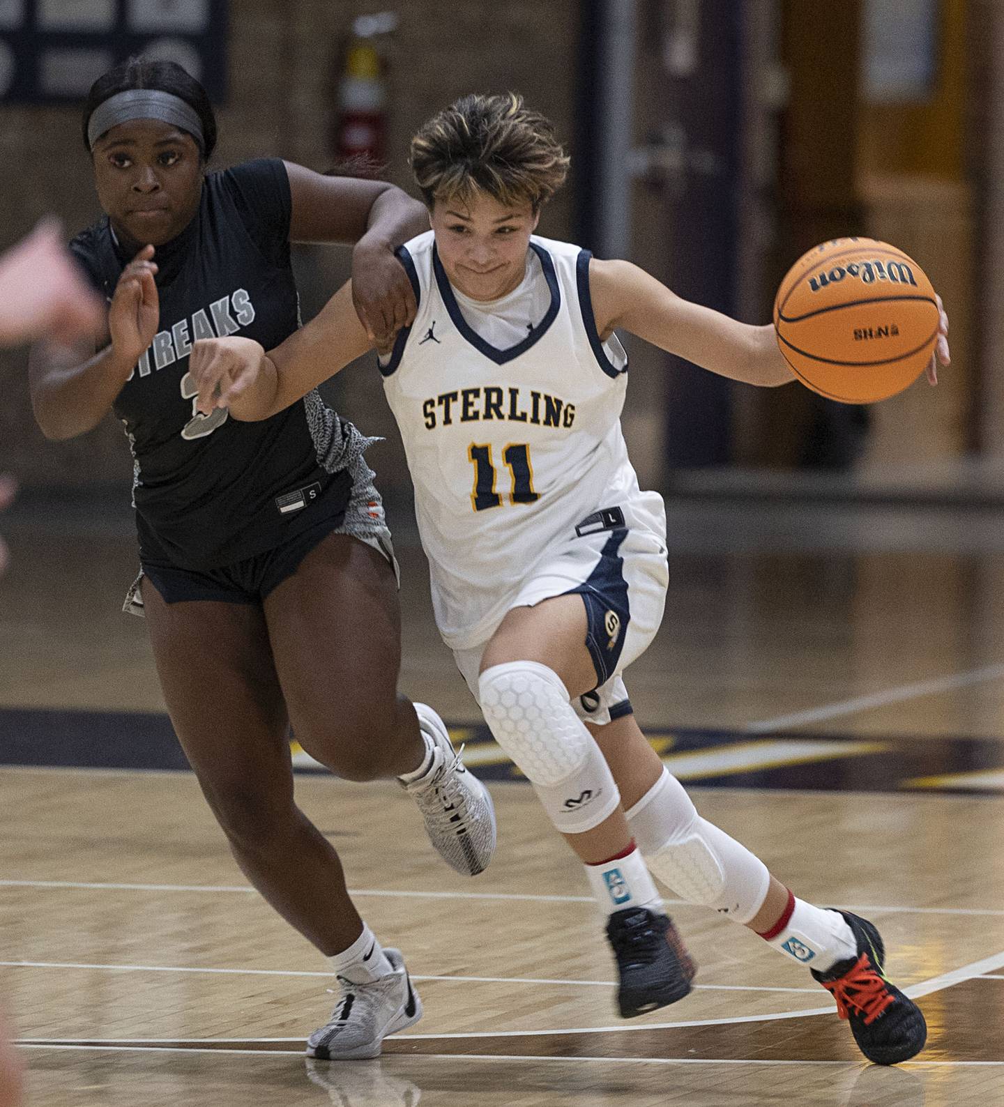 Sterling’s Joslynn James brings the ball up court against Galesburg’s Khloe May Thursday, Dec. 4, 2025.