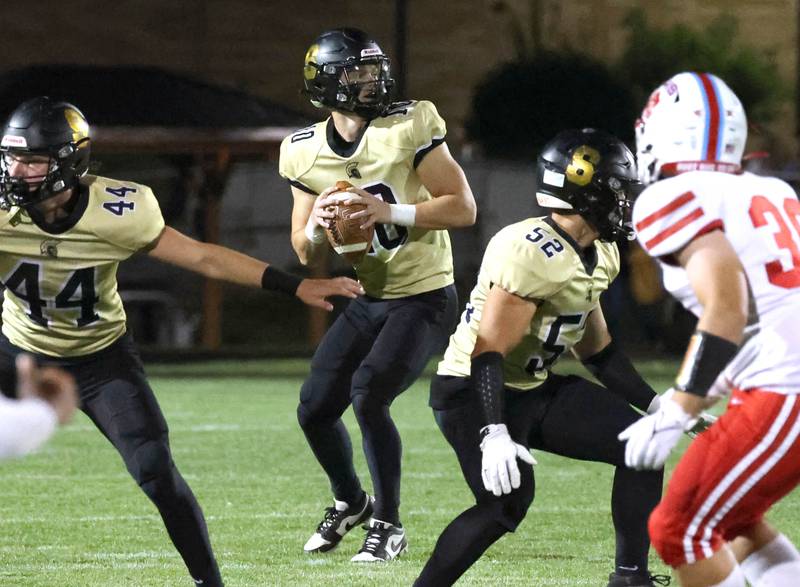 Sycamore's Burke Gautcher finds a receiver wide open in the Ottawa secondary for a touchdown during their game Friday, Sept. 27, 2024, at Sycamore High School.