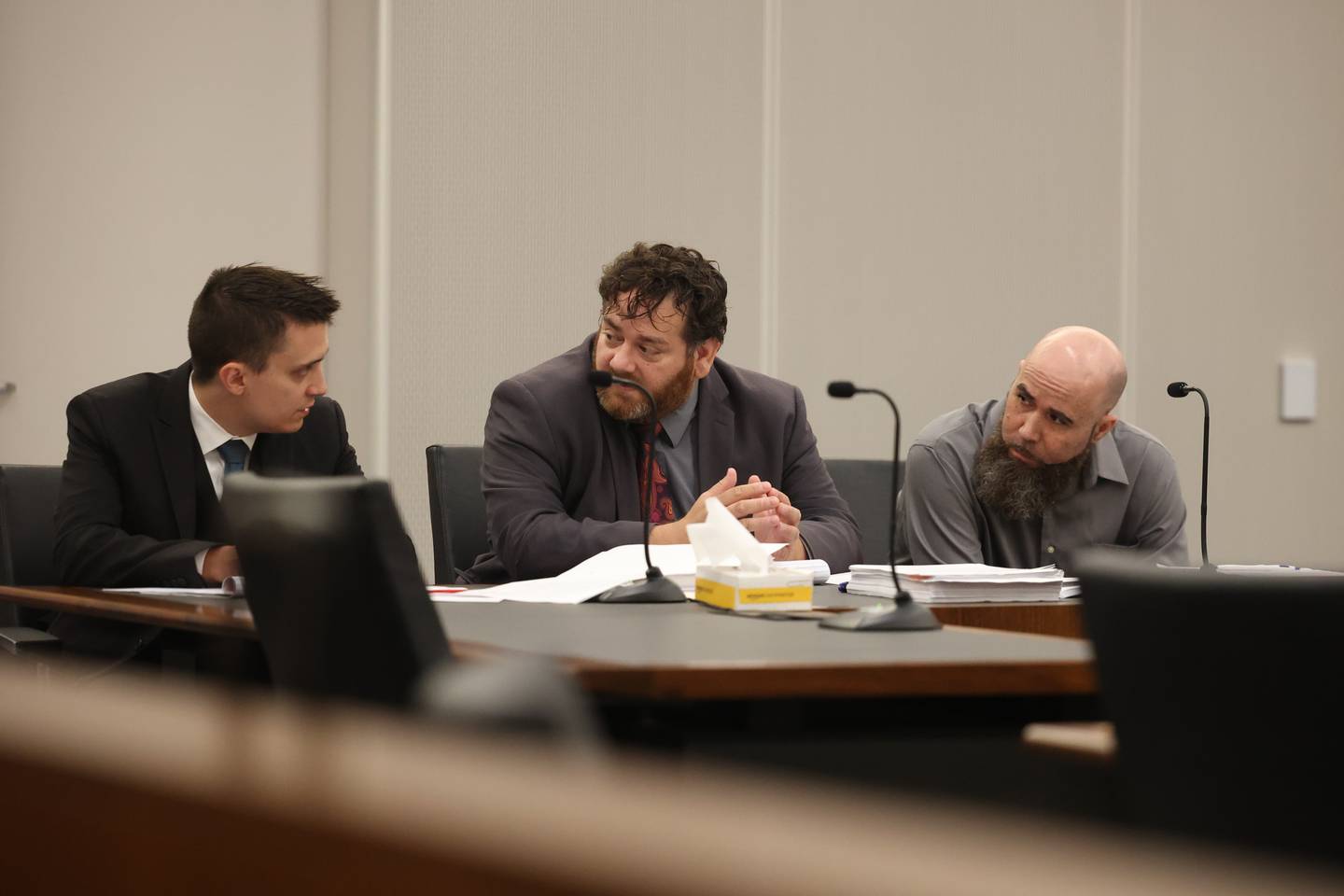 Jermaine Mandley, 47, of Bolingbrook, right, listens to his defense team Zack Strupeck, left, Phil Villasenor converse at the Will County Courthouse on Thursday, Aug. 17, 2023 in Joliet. Mandley is on trial for the alleged shooting of Maya Smith, 24, in June 2022.