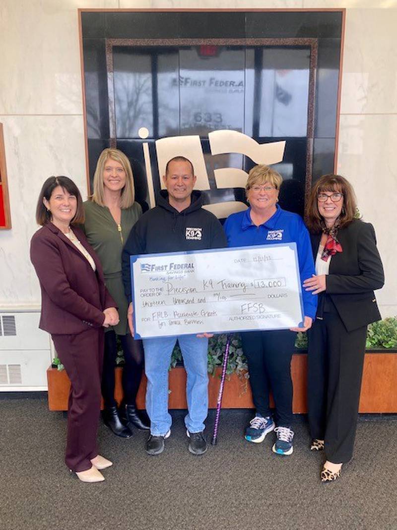 First Federal Savings Bank and FHLB Chicago awarded $13,000 in Partnership Grant Program funds to Precision K-9 Training of Ottawa, during a ceremonial check presentation Dec. 21, at the corporate headquarters at First Federal Savings Bank.