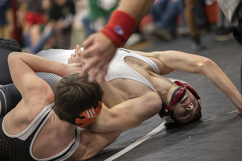 Fulton’s Broden Venhuizen works to not be pinned by Illini Bluff’s Ian O’Connor in the 132 pound title match Saturday, Dec. 17, 2022 at the Erie-Prophetstown Holiday Tournament.