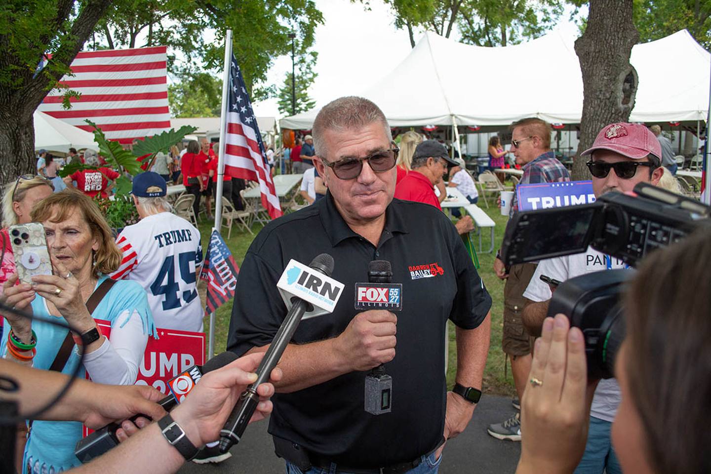 State Sen. Darren Bailey appears at a news conference alongside law enforcement officers during his 2022 campaign for governor.