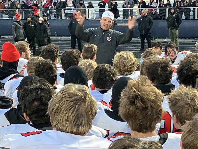 Lincoln-Way Central coach Dave Woodburn talks to his players after Saturday’s 31-28 7A playoff loss to St. Rita.