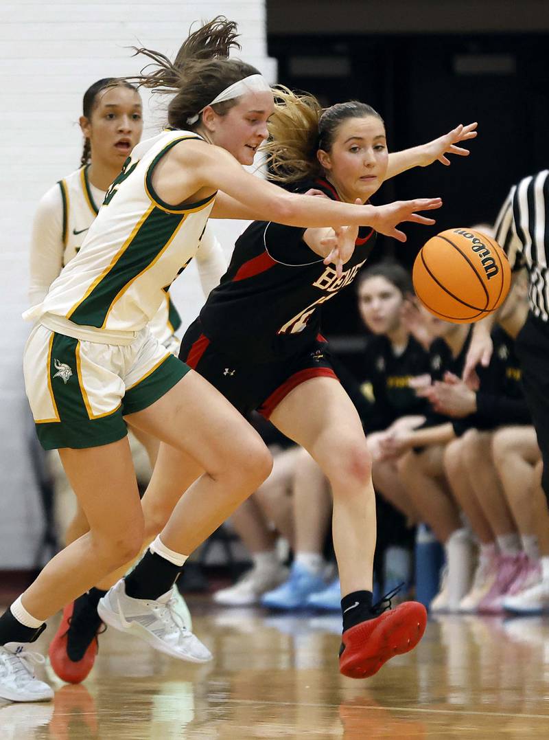 Fremd’s Ella Todd (22) and Benet Academy's Lindsay Harzich (12) battle for a loose ball during the Montini girls basketball Christmas tournament Saturday, Dec. 28, 2024 in Lombard.