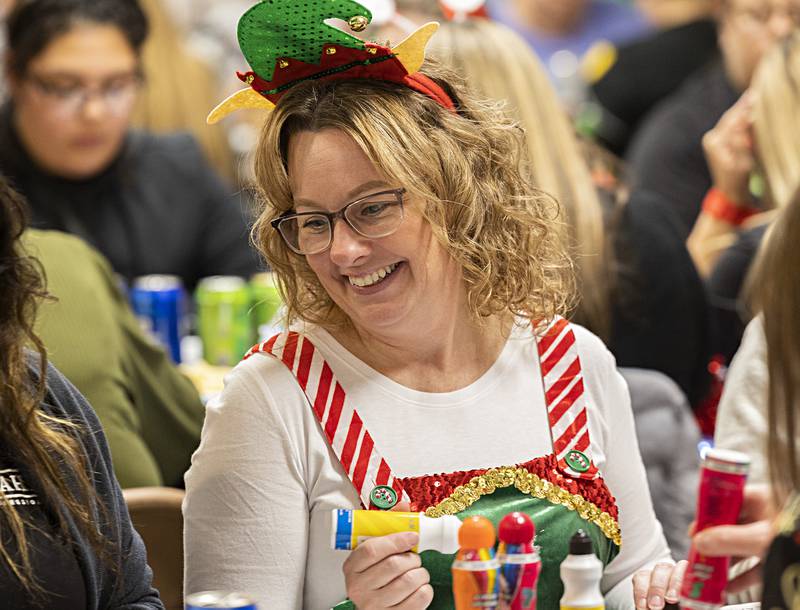 April Schmidt personifies the fun event with holiday themed dress and a big smile Thursday, Nov. 16, 2023.