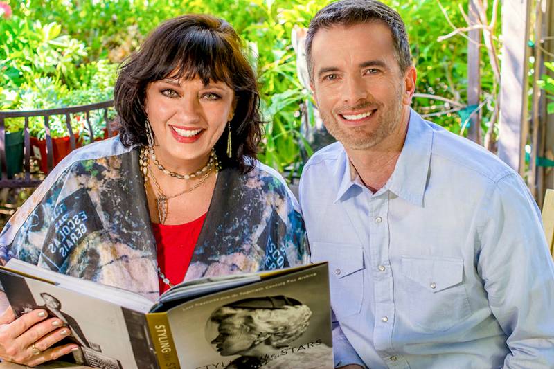 Angela Cartwright and former New Lenox resident Tom McLaren pose with their book, "Styling the Stars: Lost Treasures from the Twentieth Century Fox Archive."