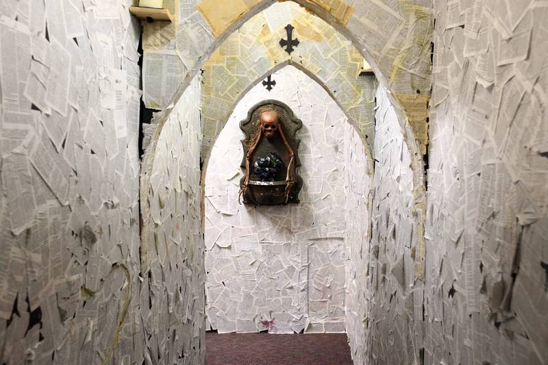 A tunnel of pages lead to the church and chapel hallway in the Insanity Haunted House at the Peru Mall on Monday Sep. 27, 2021.