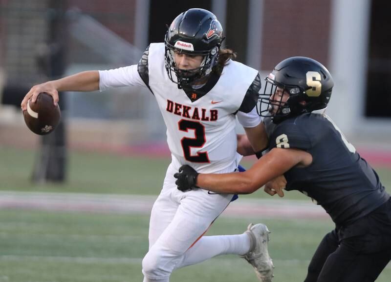 Sycamore's Diego Garcia sacks DeKalb's Cole Latimer during the First National Challenge game Friday, Aug. 25, 2023, in Huskie Stadium at Northern Illinois University in DeKalb.