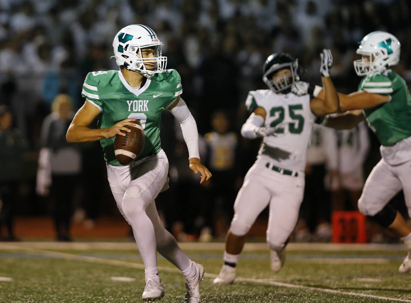 York's Matt Vezza (9) fades back to pass during the boys varsity football game between York and Glenbard West on Friday, Sept. 30, 2022 in Elmhurst, IL.