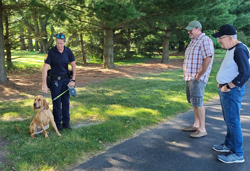 Princeton Police Officer Sara Rokey introduced Lucy, a 2 year-old bloodhound, and the department's newest K9 to Mayor Joel Quiram and Councilman Jerry Neumann during Tuesday's  National Night Out at Zearing Park.